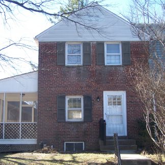 A two-story brick house in Monroe St. Arlington, Virginia